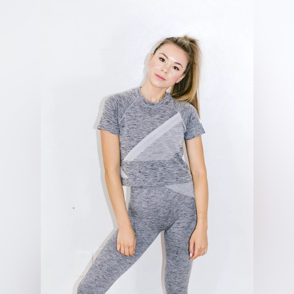 Complete LNDR Comet metallic workout set in gray, silver, and black. Size S/M